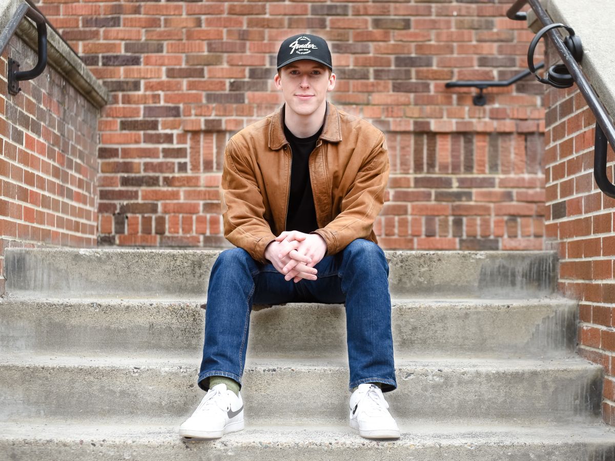 Photo of Jack Person, on the steps of UM's Brantly Hall