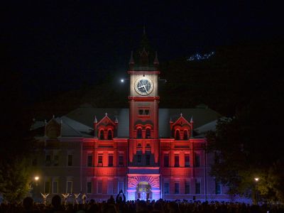 Main Hall lit up with colorful lights at the Yell Night Pep Rally