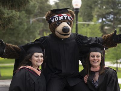 Two graduates with Monte.