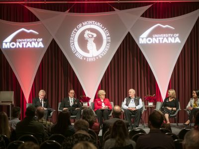 Past recipients of the Distinguished Alumni Award on stage during recognition ceremony.