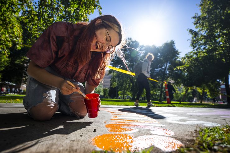 Person painting on the Hello Walk