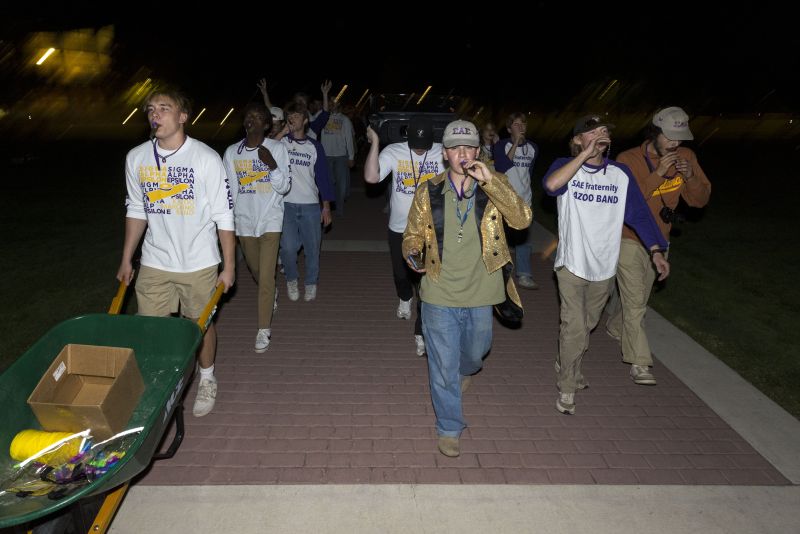 Kazoo Band performs down the sidewalk by Main Hall