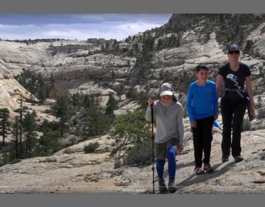 A family recreates in what appears to be the High Sierra.