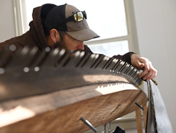 Man investigates angle of crosscut saw blade.