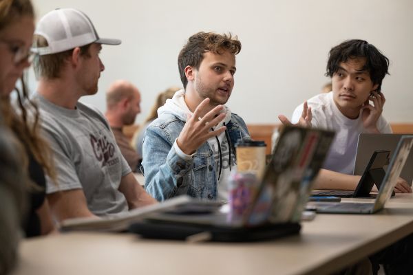 UM students talk in a classroom