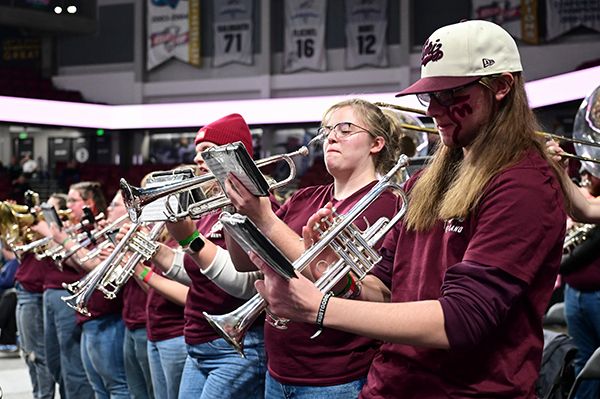 UM band members play trumpets