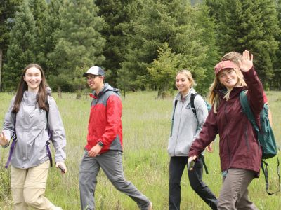 Schwanke participants waving while hiking