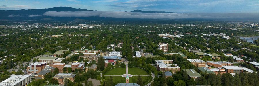 Missoula and campus seen from above with University Hall and the oval centered at the bottom