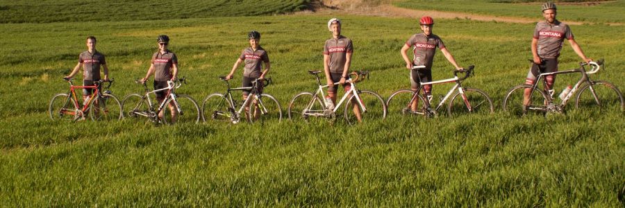 Members of UM Club Cycling Team pose in a field with their bikes