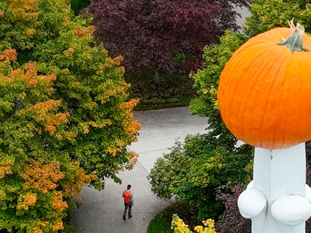A pumpkin sits speared atop Main Hall
