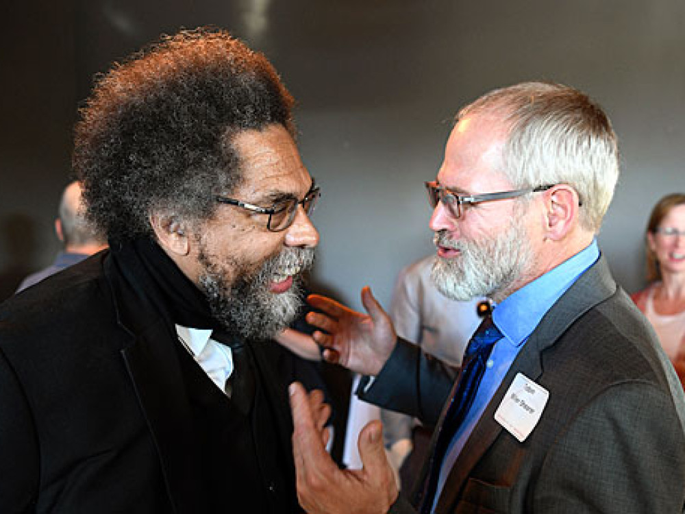 Tobin Shearer, director of UM’s African-American Studies program (right), meets with famed scholar and activist Cornel West