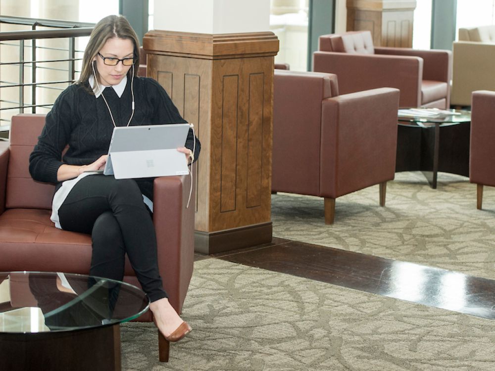 student works on a laptop in the Gilkey Center