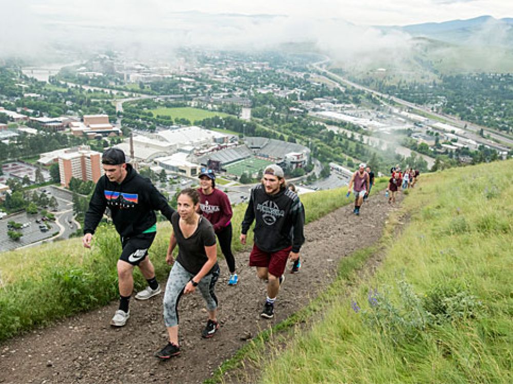 Student hikers climb the M Trail