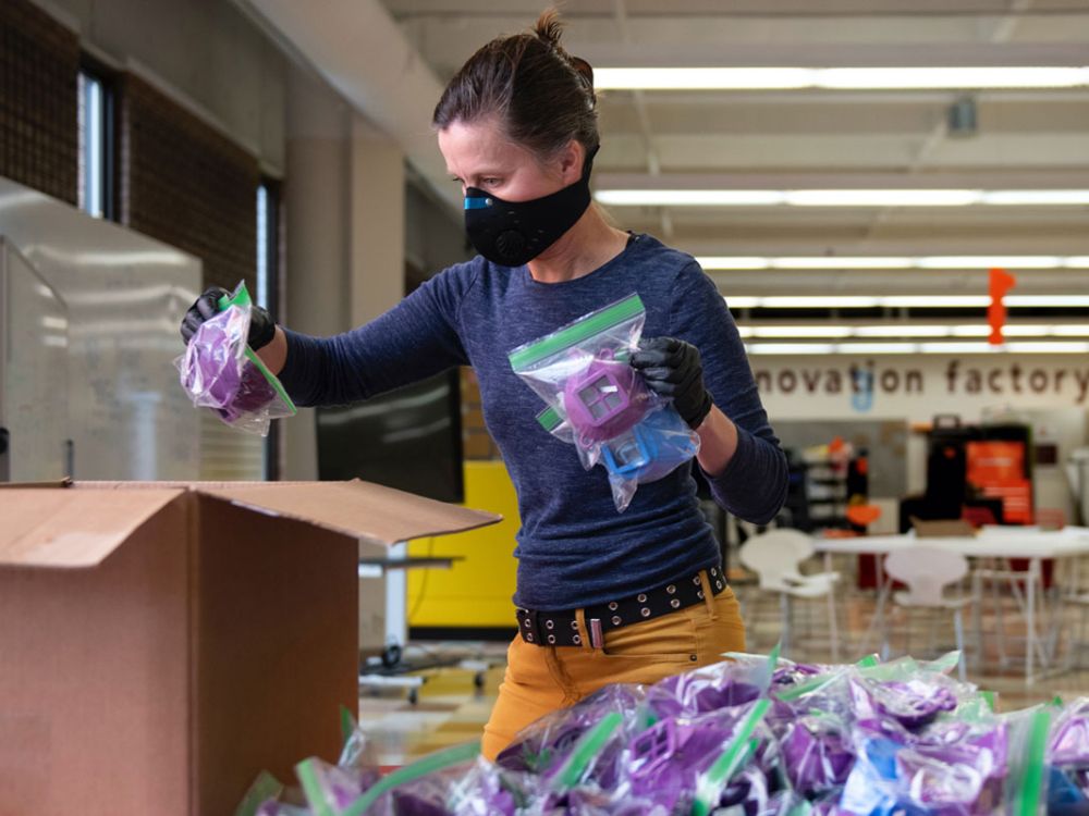 Elizabeth Dove, co-director of UM’s Innovation Factory, boxes personal protective equipment bound for the Fort Belknap Indian Reservation. 
