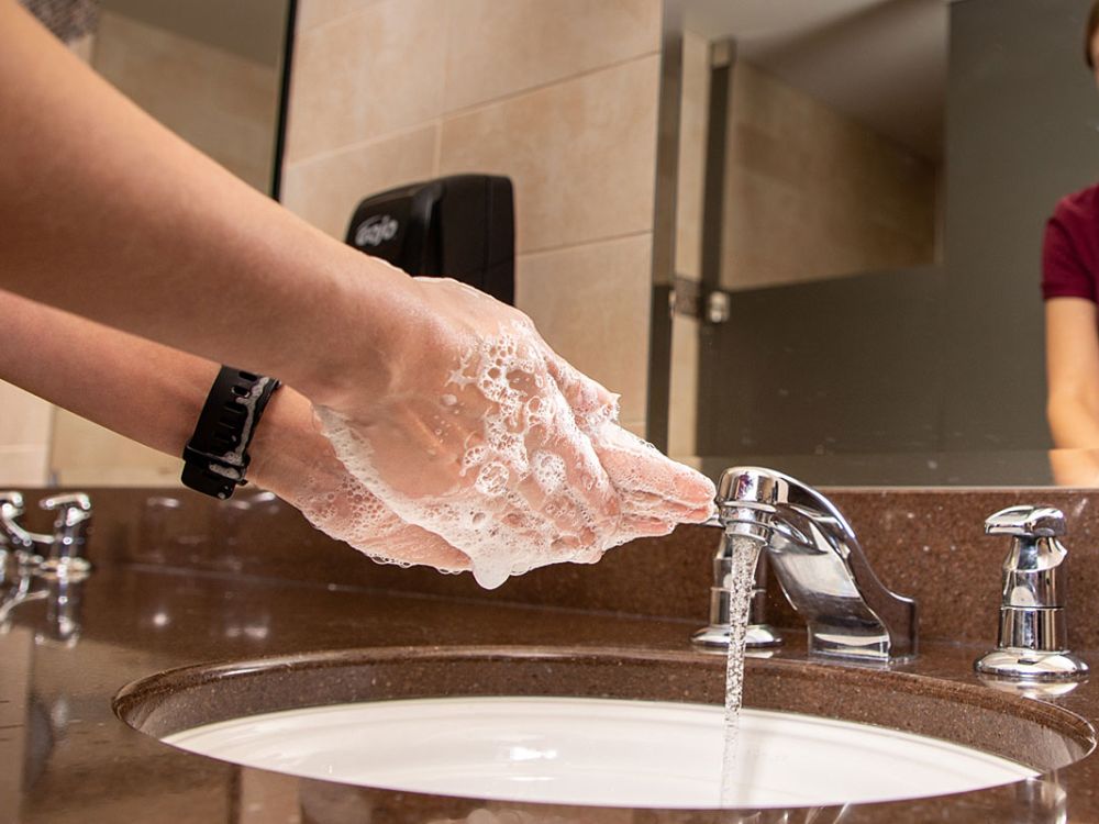 A picture of a student washing her hands
