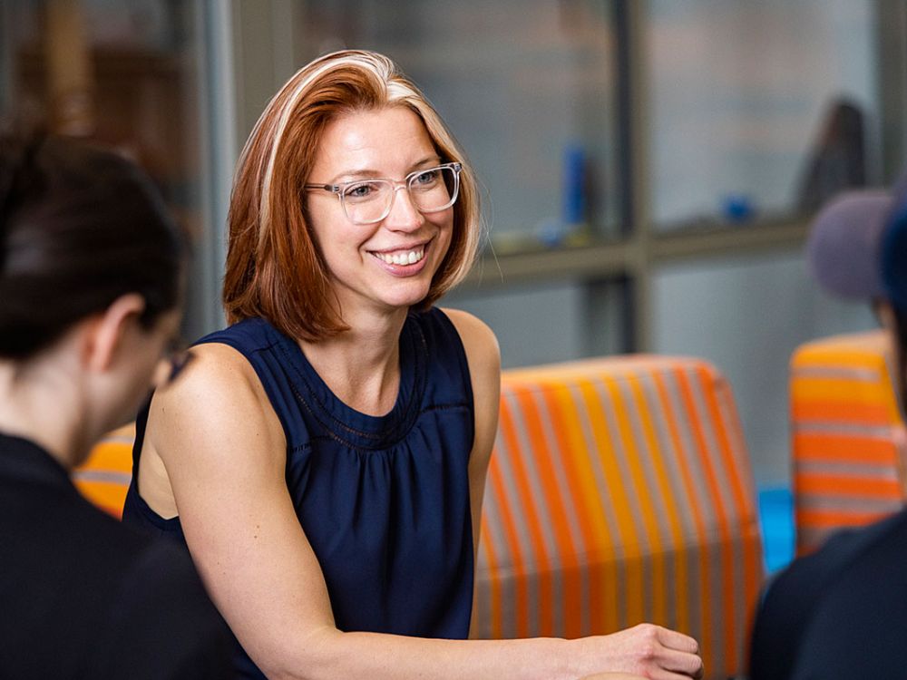An image of Mary Kreta talking to students
