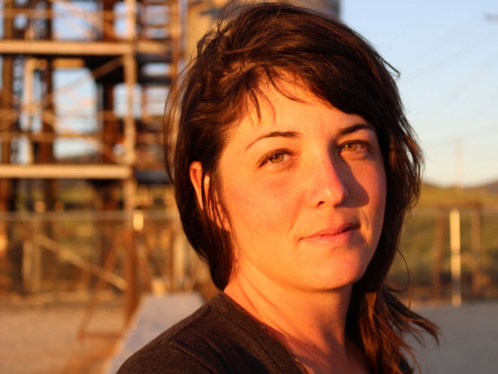 A headshot of Nora Saks, in the golden light of the sun