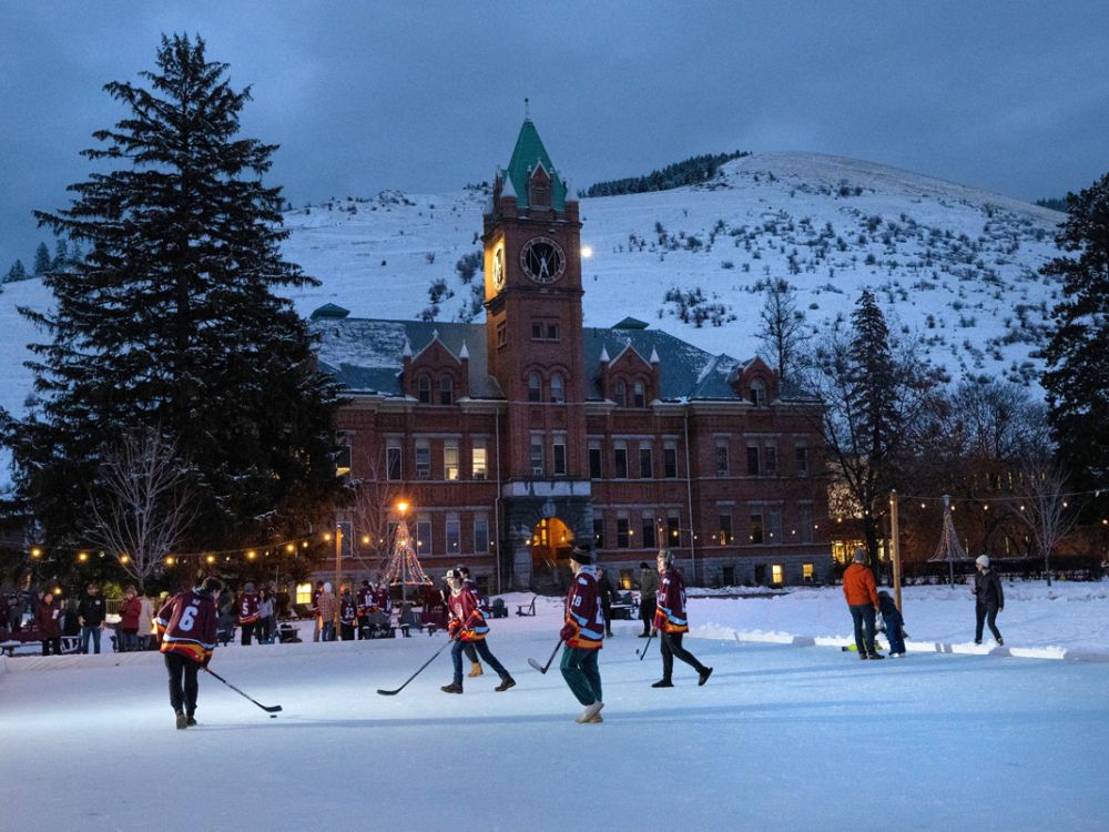 A photo of Griz Hockey players on the UM Oval. 