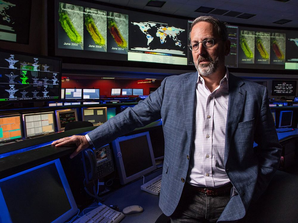 A photo of Jay Famiglietti in front of monitors. 