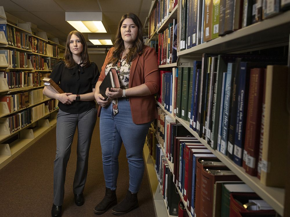 Photo of law students standing in law library