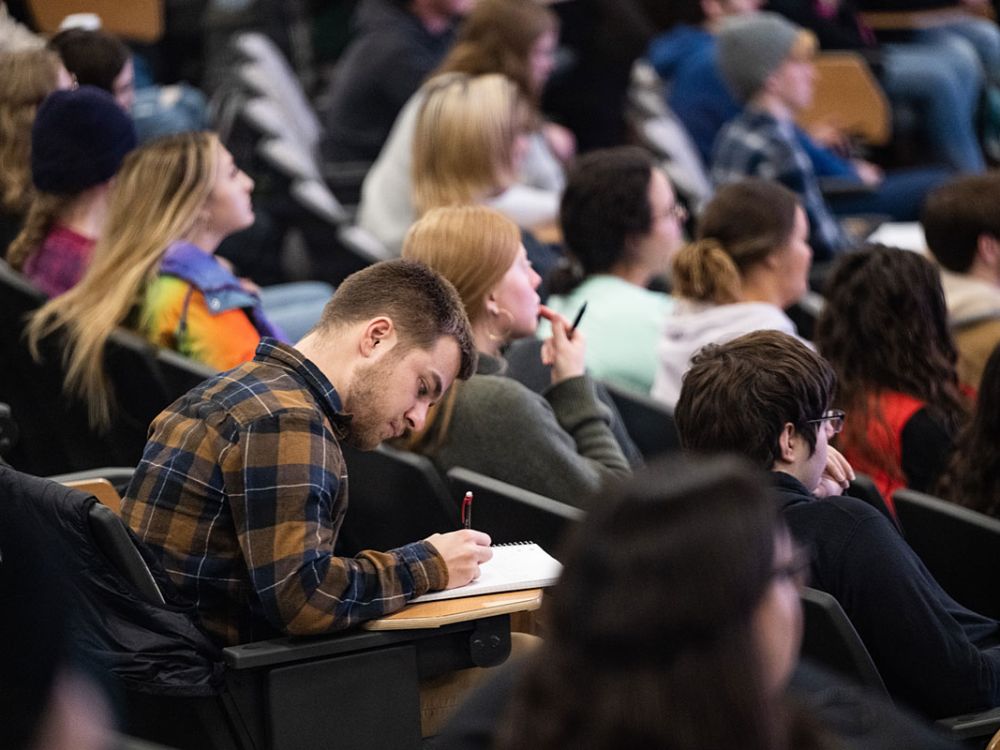 A picture of many students in class at UM.