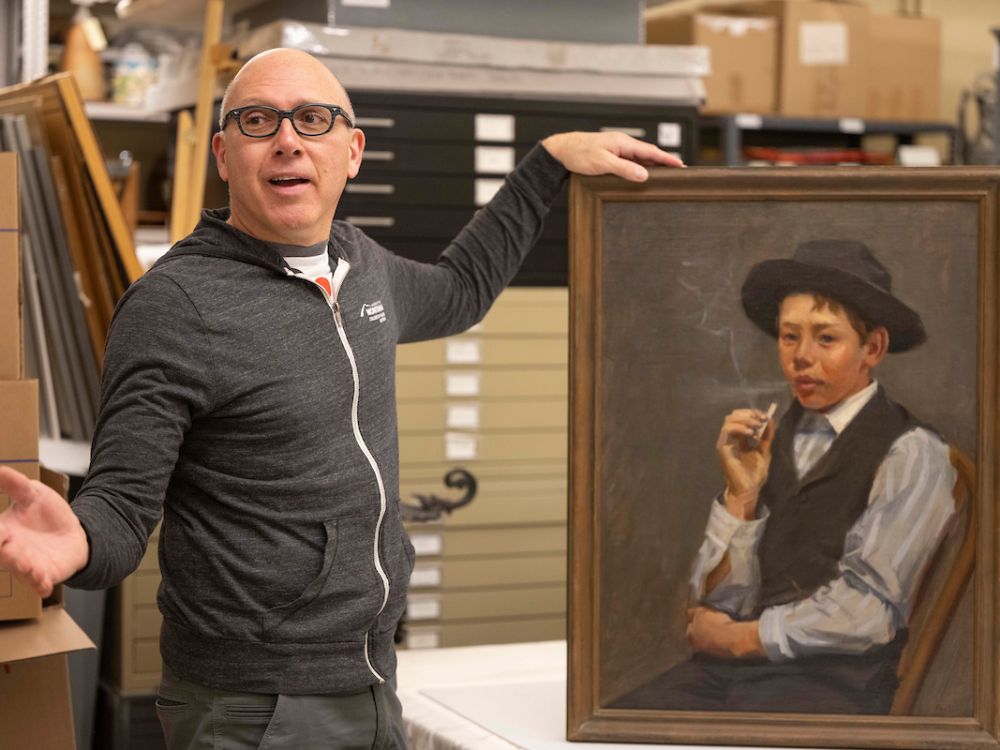 Photo of Rafael Chacon with lost artwork