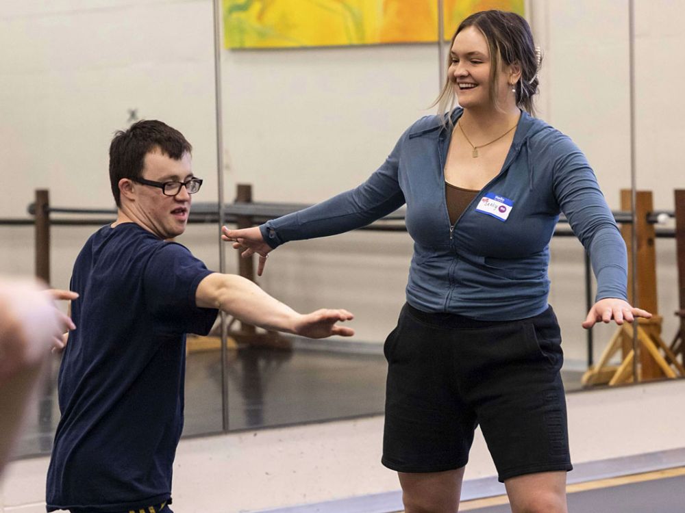 Seely Garrett (right) works with participant Liam Mulcaire-Jones in New Visions Dance class. 