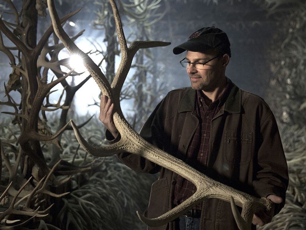 Doug Emlen holds an elk antler.