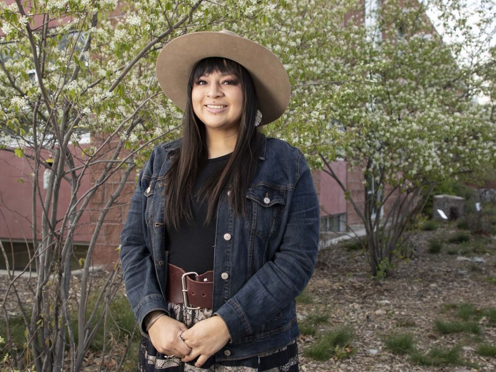 Courtney Little Axe posses for photo by Payne Center