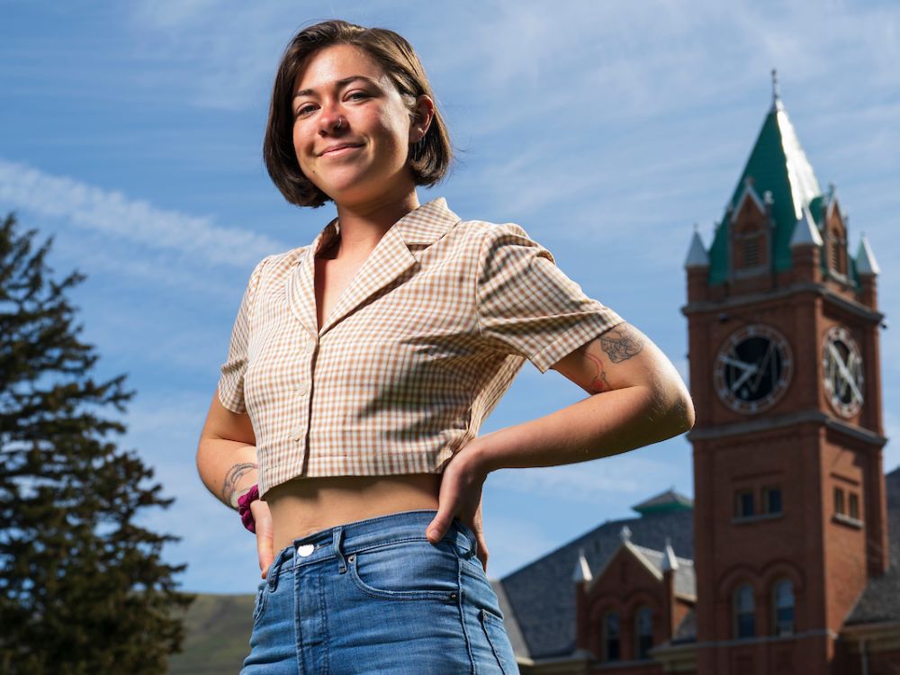 Tess Jarden posses for photo in front of Main Hall
