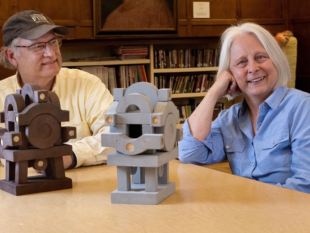 Photo of Hugh Warford and Lisa Autio with model of Signal