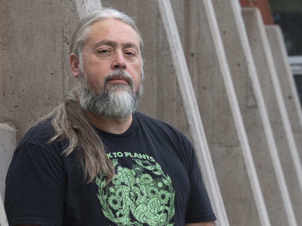 A headshot photo of poet Chris La Tray. 