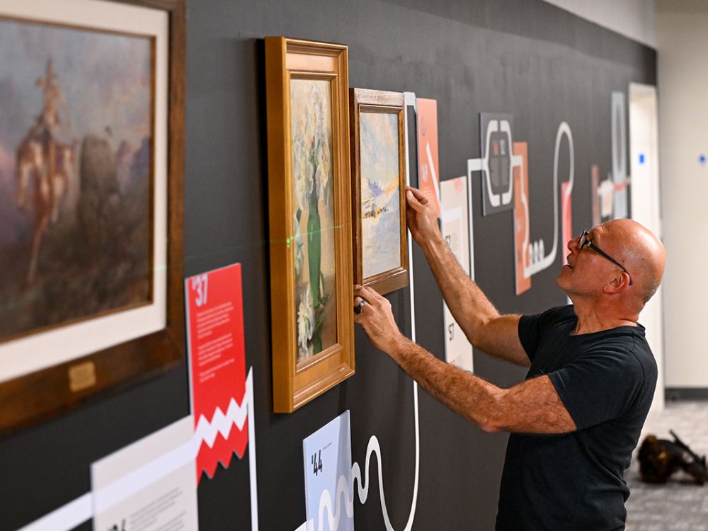 Photo of Rafael Chacon hanging art