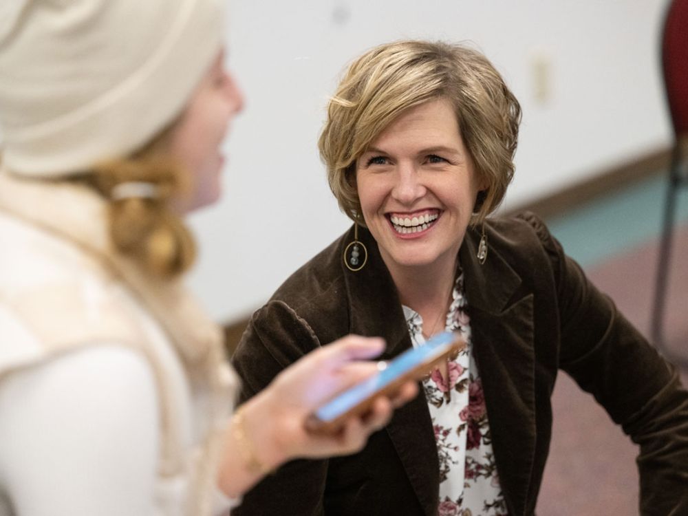 Heather Voorhees, a UM communication studies assistant professor, visits with a student in her new Health Misinformation class. 