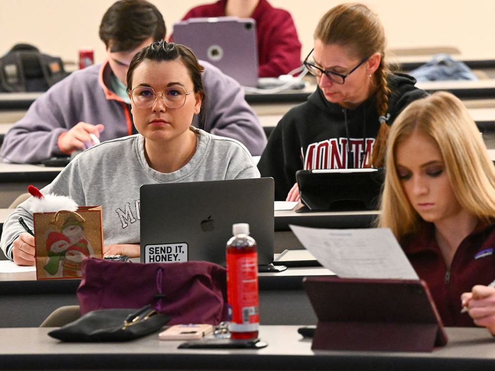 UM students listen to an instructor in class.