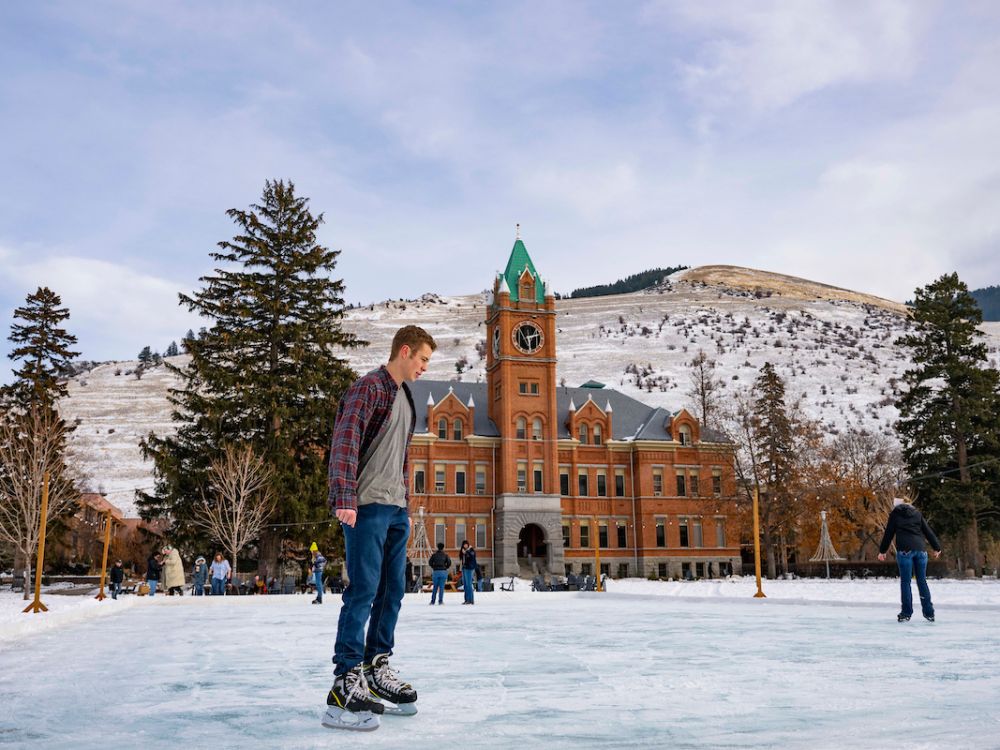 Students skate on the Oval in front of Main Hall
