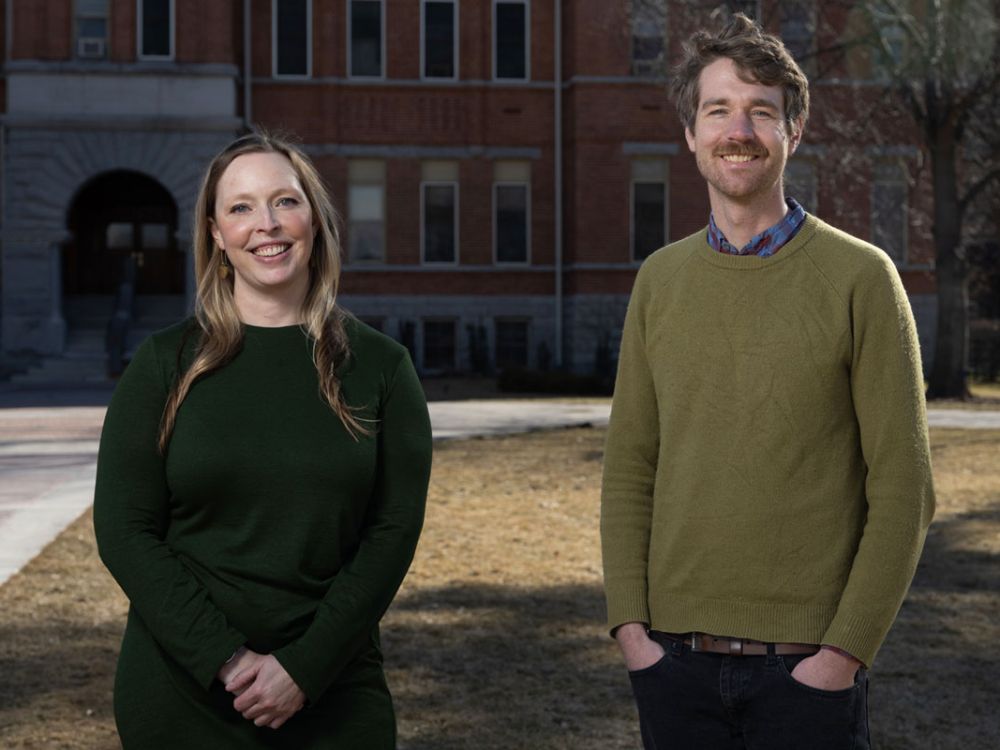 UM researchers Beverly Piggott and Doug Brinkerhoff  before Main Hall