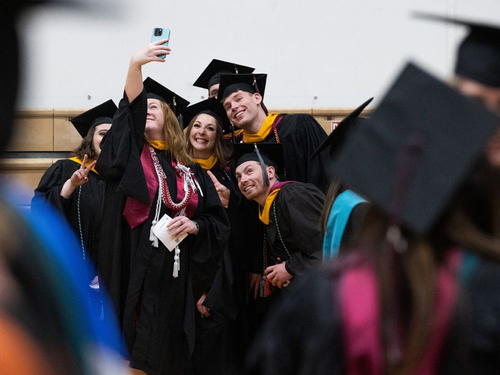 UM students pose for a group selfie.