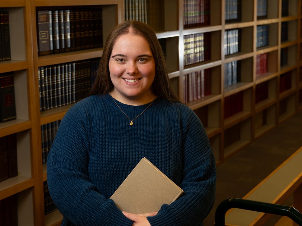 Student Jayden Beed, pictured in UM’s Jameson Law Library