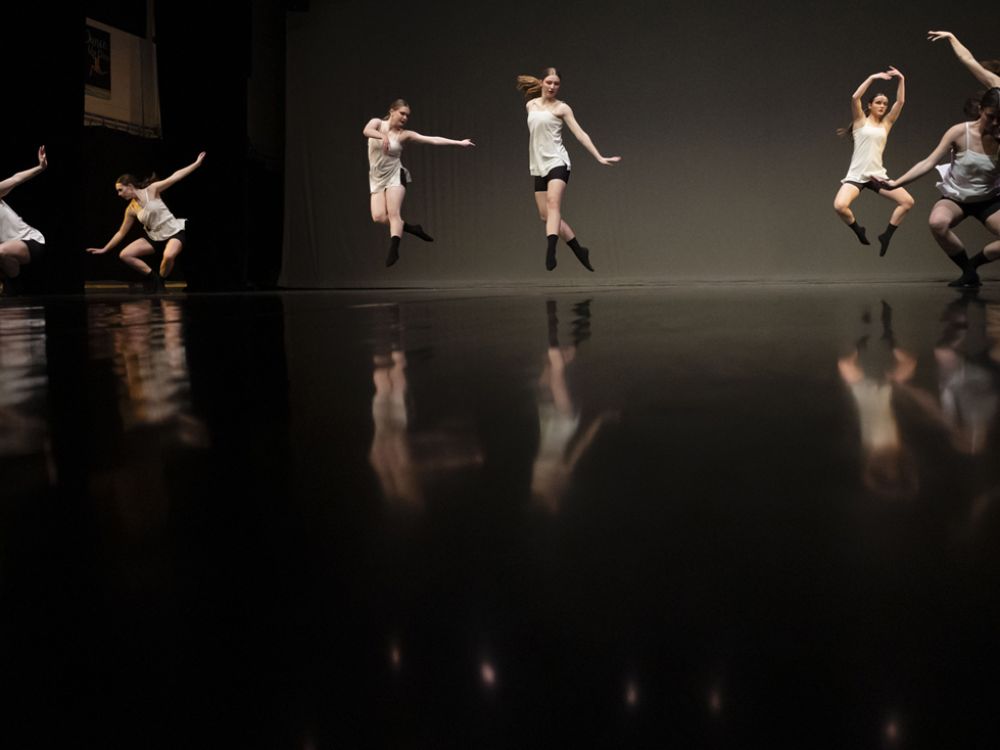 An image of dancers performing "The Sedge" on stage. 