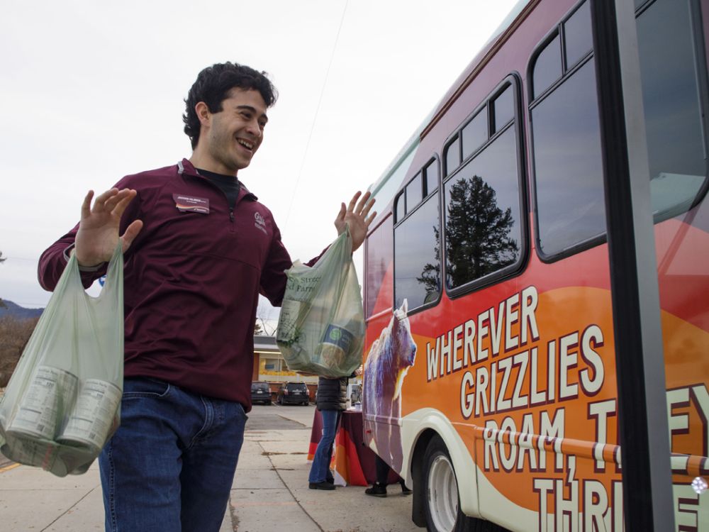 A UM student volunteers for Can the Cats.