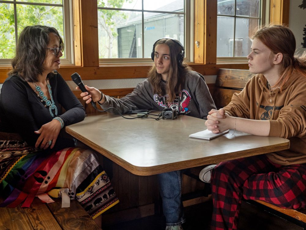 An image of students interviewing someone. 