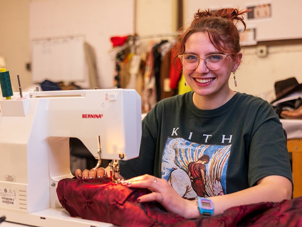 A picture of Ronnie Avansino at a sewing machine.