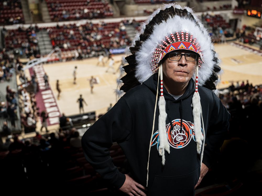 Lyle Omeasoo stands above Robin Selvig Court in the Adams Center at the University of Montana 
