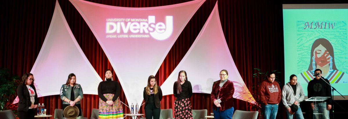 group of speakers on stand in front of a Diverse U banner