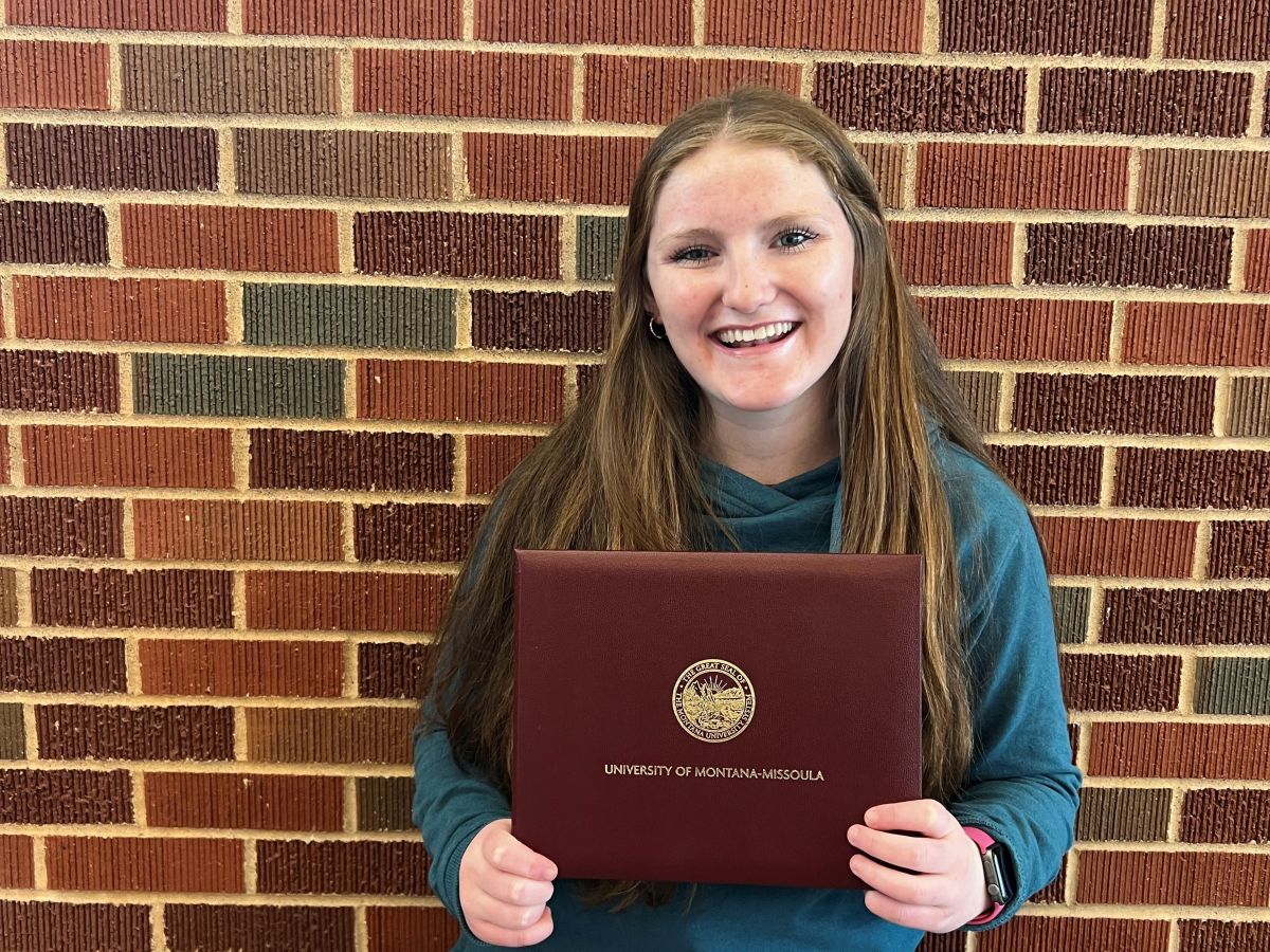 Elementary Education major, Annie McLaverty holds a scholarship certificate.