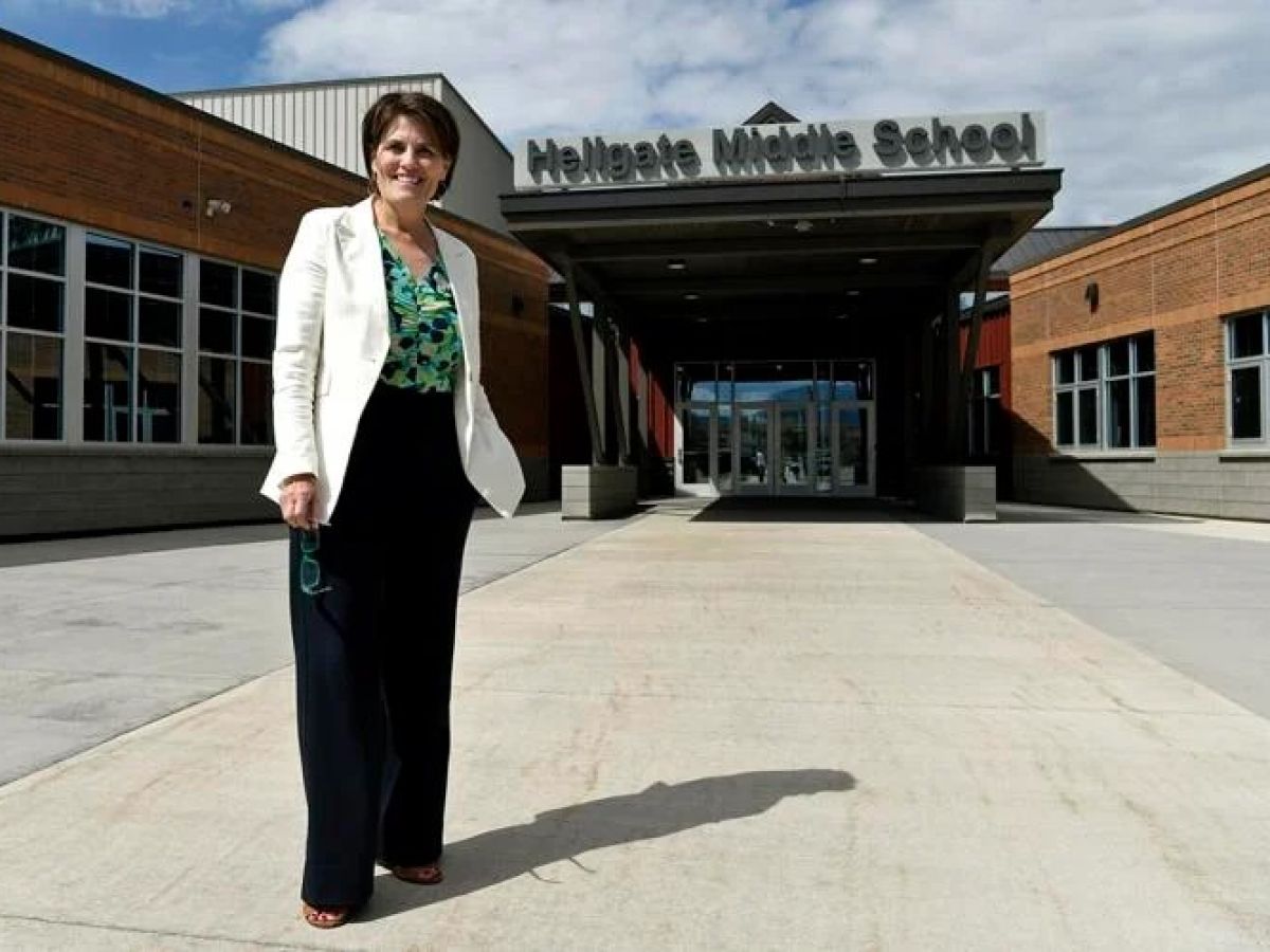 Blakely stand in front of Hellgate Elementary.