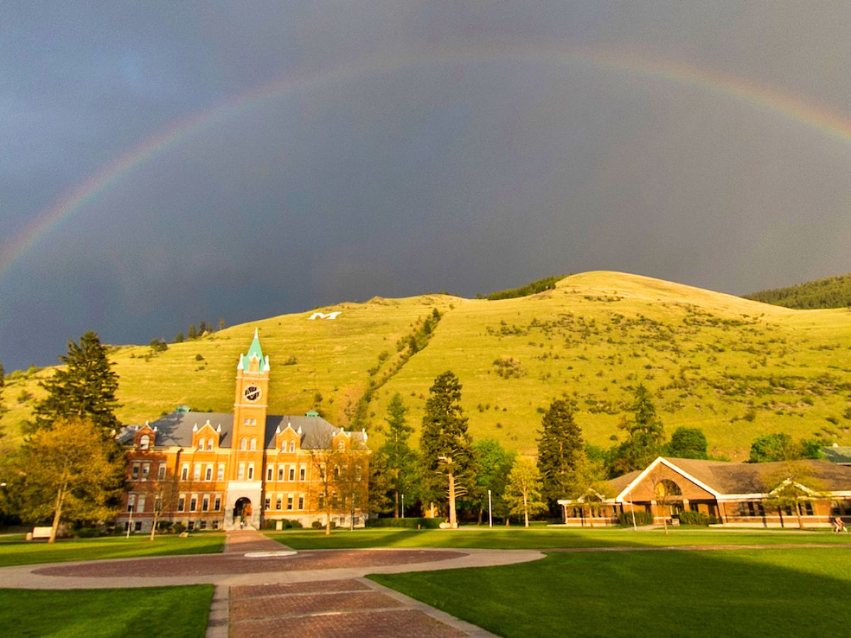 UM Main Hall and Davidson Honors College with a rainbow overhead