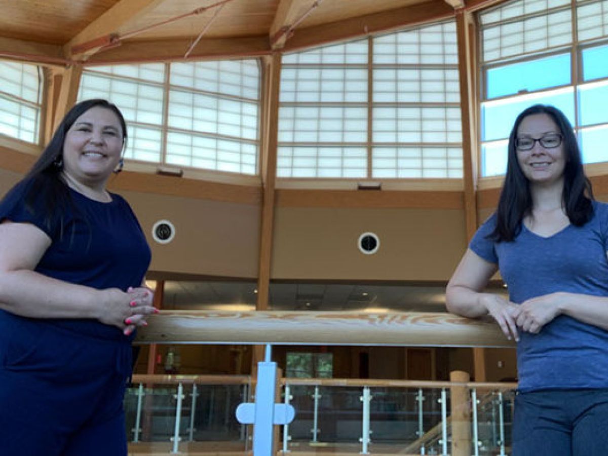 Photo of 2 women standing together.