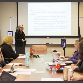 Faculty member teaching to students